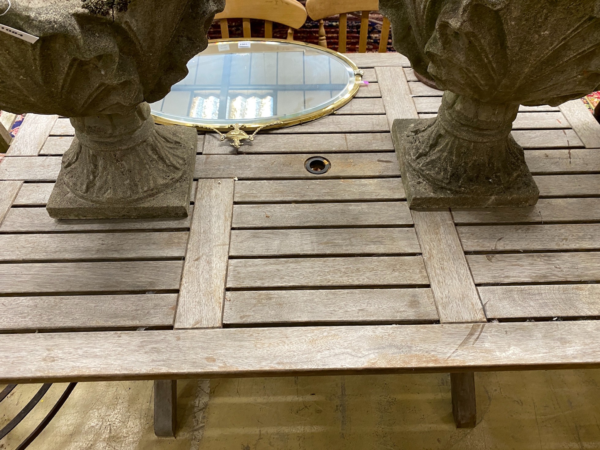 A weathered teak rectangular topped garden table, length 162cm, height 111cm